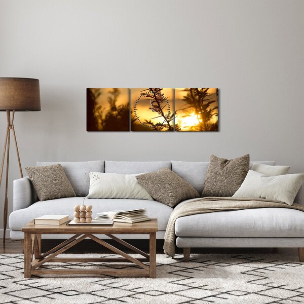 Obraz - Slnko zapadajúce za stromami (s hodinami) (90x30 cm)