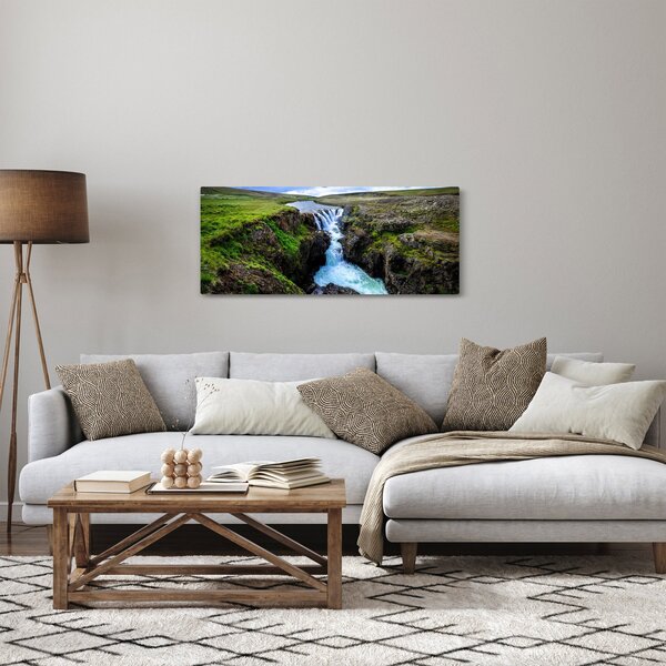 Obraz vodopádu medzi skalami (120x50 cm)