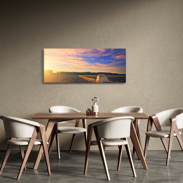 Obraz žltého auta v poli (120x50 cm)