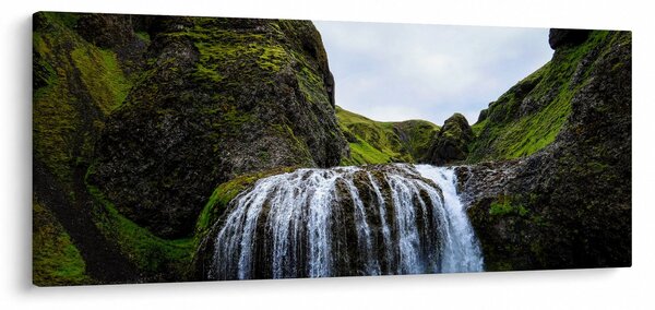 Obraz útesu s vodopádom (120x50 cm)