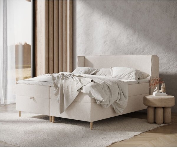 Krémová boxspring posteľ s úložným priestorom 180x200 cm Monpelli – Maison de Rêve