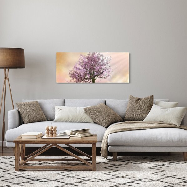 Obraz rozkvitnutého stromu na vrchole kopca (120x50 cm)