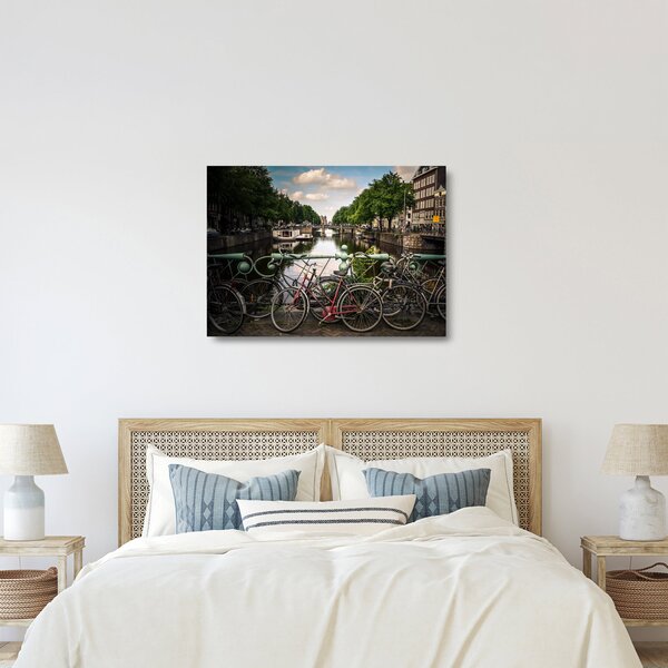 Sklenený obraz bicykla v meste (70x50 cm)