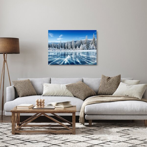 Sklenený obraz zamrznutého jazera a zasnežených stromov (70x50 cm)