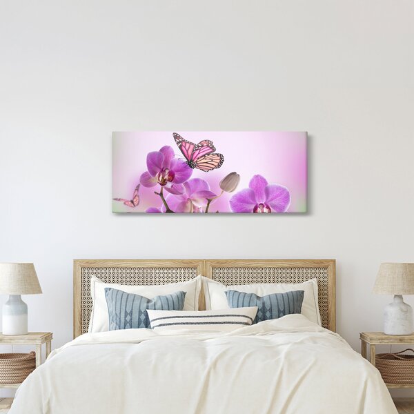 Obraz - Motýľ na kvetoch orchidey, lila (120x50 cm)