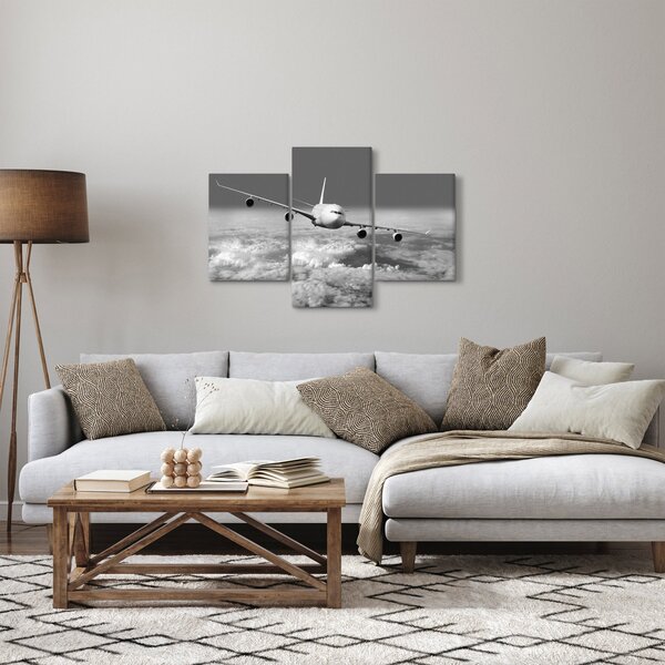 Obraz - Lietadlo v oblakoch, čiernobiele (90x60 cm)