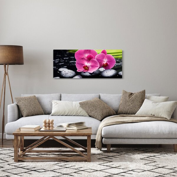 Obraz - Ružové orchidey s palmovým listom (120x50 cm)