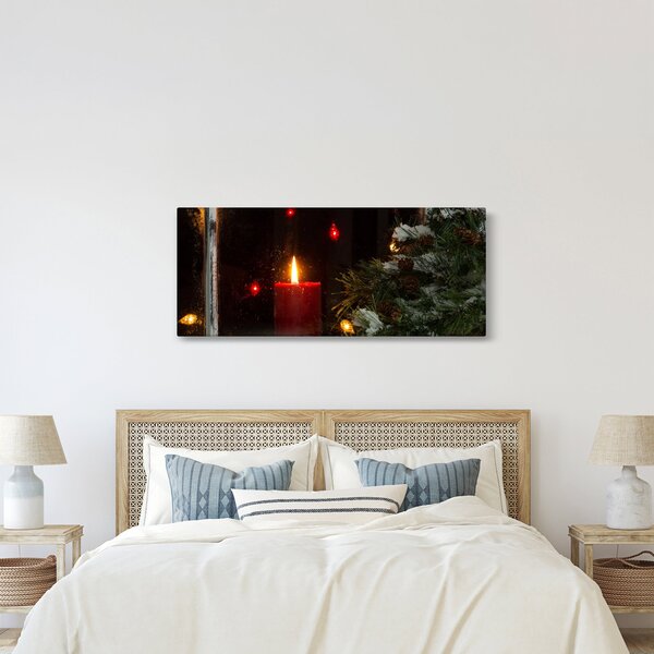 Obraz - Žiariaca vianočná sviečka (120x50 cm)