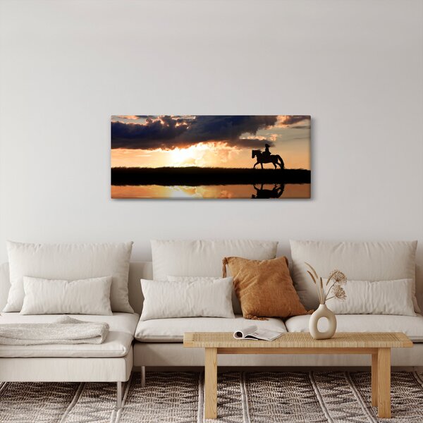 Obraz - Jazdec na koni pri západe slnka (120x50 cm)