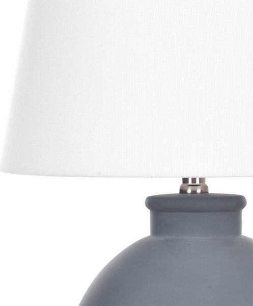 Stolná lampa sivý keramický podstavec biele ľanové tienidlo minimalistický dizajn