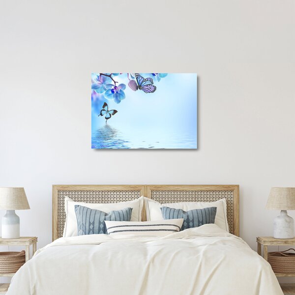 Sklenený obraz - Motýľ na kvetoch orchidey, modrý (70x50 cm)