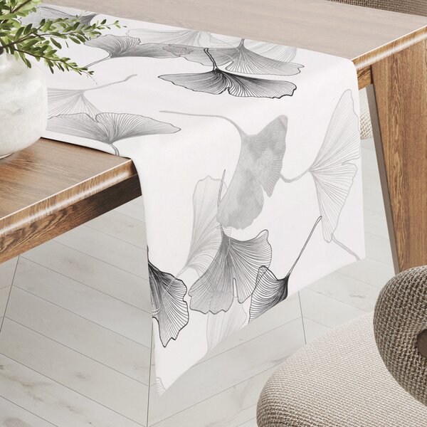Biante Bavlnený behúň na stôl Sandra SA-512 Sivo-biele ginkgo listy na bielom 20x140 cm