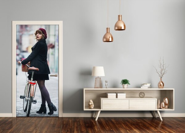 Fototapeta samolepiace dvere žena na bicykli 75x205 cm