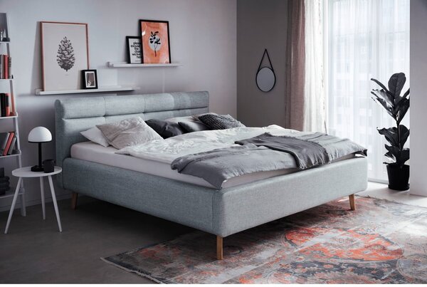Sivomodrá čalúnená dvojlôžková posteľ s úložným priestorom s roštom 180x200 cm Lotte – Meise Möbel