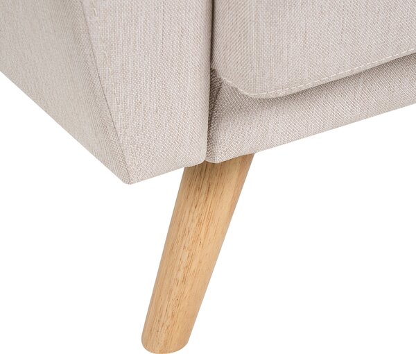 Kreslo béžové čalúnené sedadlo a operadlo drevené nohy moderná minimalistická obývacia izba