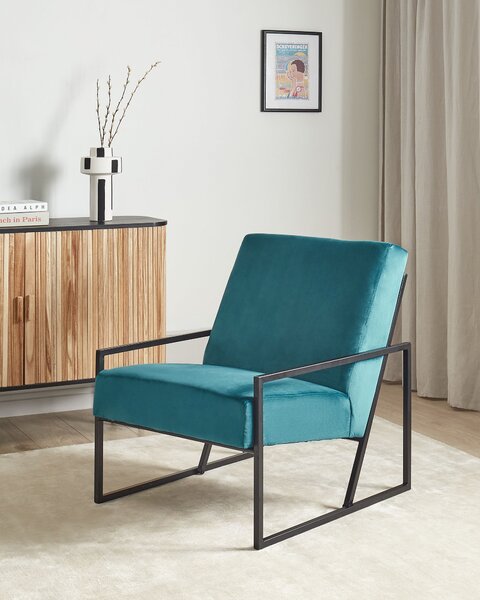 Kreslo modrozelené zamatové čalúnené čierny železný rám moderná elegantná obývacia izba