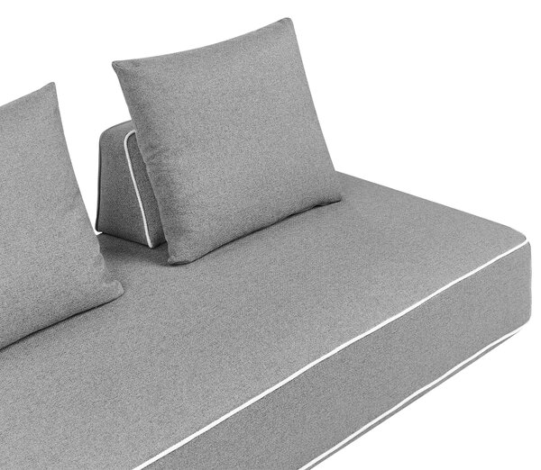 Leňoška sivá látkové čalúnenie s vankúšmi moderný minimalistický štýl obývacia izba