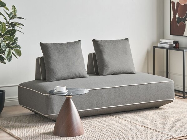 Leňoška sivá látkové čalúnenie s vankúšmi moderný minimalistický štýl obývacia izba