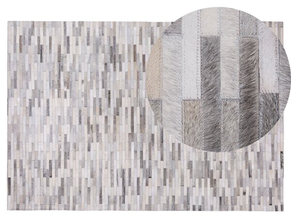Koberec sivý z hovädzej kože 140 x 200 cm ručne vyrobený moderný s nízkym vlasom