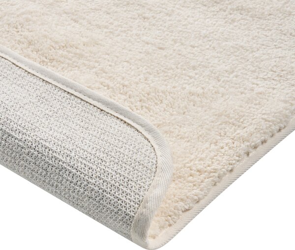 Kúpeľňová predložka krémová biela mikrovlákno 60 x 90 cm protišmyková podložka mäkký kúpeľňový koberec