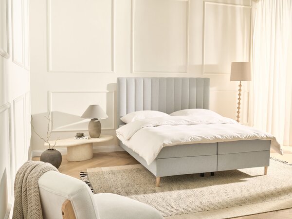 Kontinentálna posteľ s úložným priestorom krémová biela látkové čalúnenie 160 x 200 cm moderný štýl spálňa