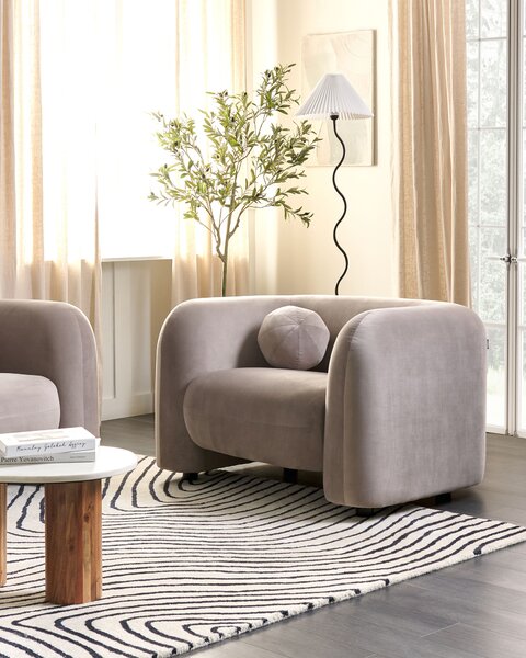 Kreslo sivobéžové zamatové čalúnenie okrúhly vankúš retro glamour art deco štýl obývačka spálňa