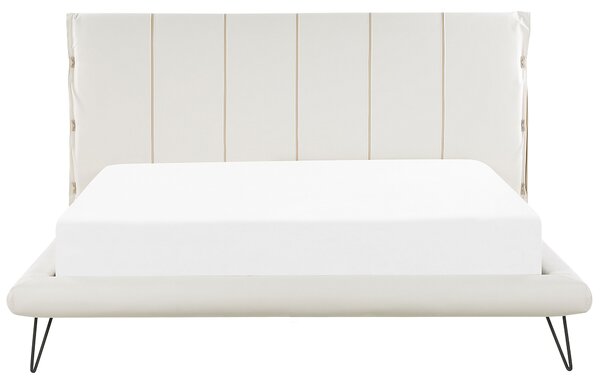 Posteľ svetlobéžová umelá koža 180 x 200 cm prešívané čelo postele tenké čierne nohy moderný dizajn