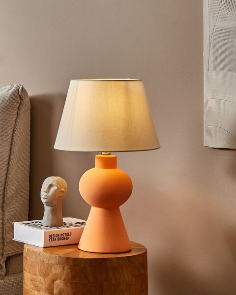 Stolná lampa oranžová keramický podstavec ľanové tienidlo v tvare bubna minimalistický dizajn