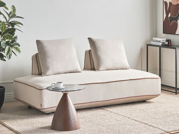 Leňoška svetlobéžová látkové čalúnenie s vankúšmi moderný minimalistický štýl obývacia izba