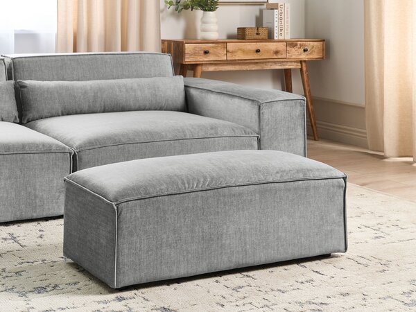 Taburet sivý látkové čalúnenie podnožka minimalistický moderný štýl obývacia izba
