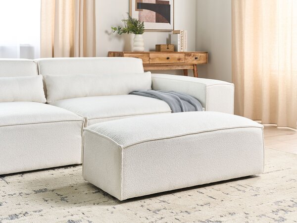 Taburet biely buklé čalúnenie podnožka minimalistický moderný štýl obývacia izba