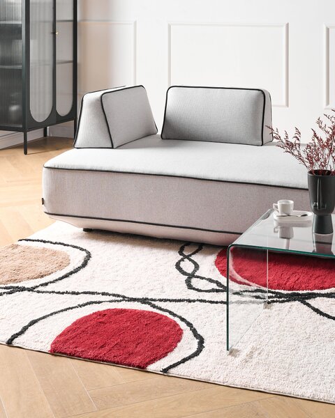 Bavlnený koberec béžový a červený 140 x 200 cm abstraktný vzor strapce nízky vlas moderný dizajn