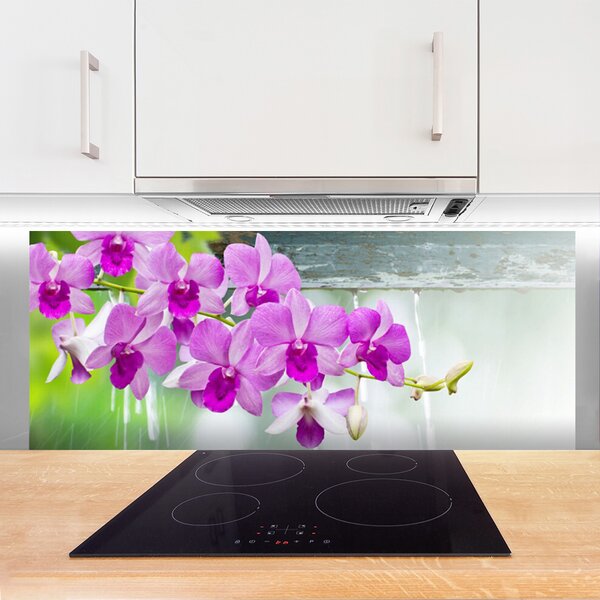 Sklenený obklad Do kuchyne Orchidey kvapky príroda 125x50 cm