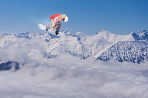 DIMEX | Vliesové fototapety na stenu Letiaci snowboardista na horách MS-5-1569 | 375 x 250 cm | modrá, biela