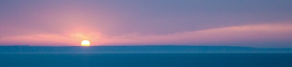 DIMEX | Fototapeta do kuchyne Slnko nad horizontom KI-260-192 | 260 x 60 cm | modrá, ružová, žltá
