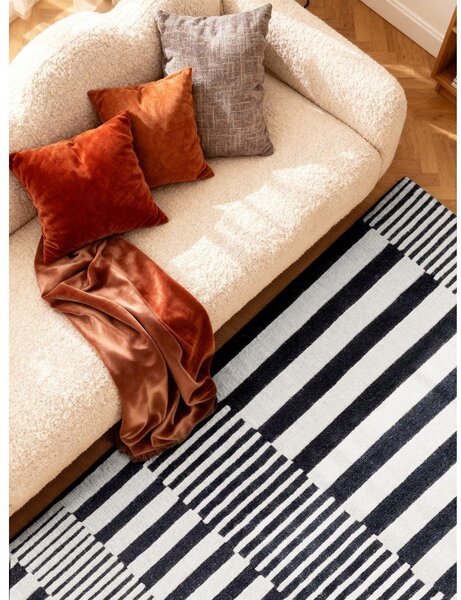 Čierno-biely ručne tkaný vlnený koberec 120x180 cm Stryve Pulse – Elle Decoration
