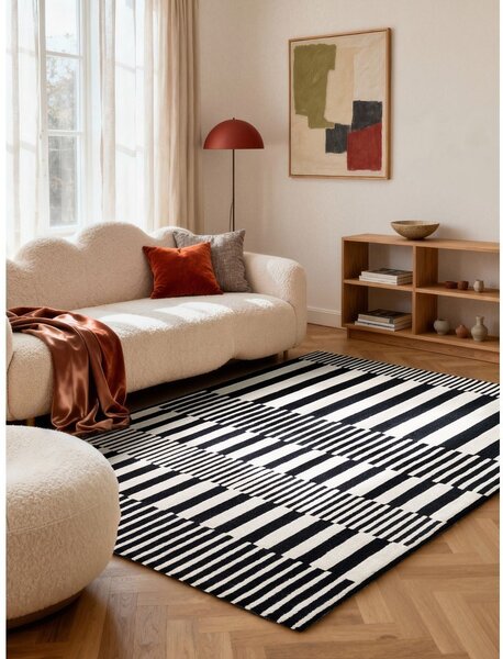 Čierno-biely ručne tkaný vlnený koberec 120x180 cm Stryve Pulse – Elle Decoration