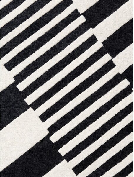 Čierno-biely ručne tkaný vlnený koberec 120x180 cm Stryve Flux – Elle Decoration